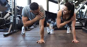 Toning Bingo Wings: Your Ultimate Guide to Sculpting Sleek Arms at the Gym 3 Fitness trainer demonstrating arm toning exercises Bournemouth